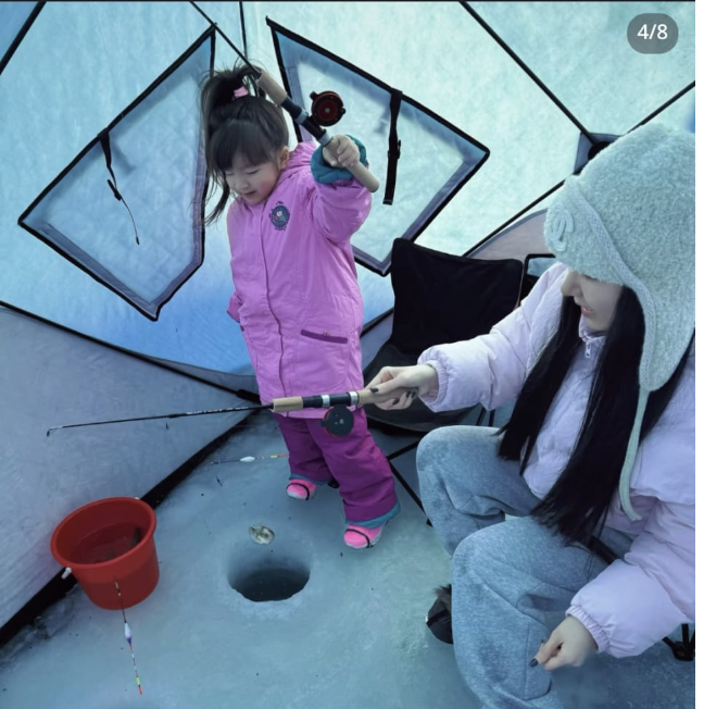 Ice fishing on a frozen lake in winter